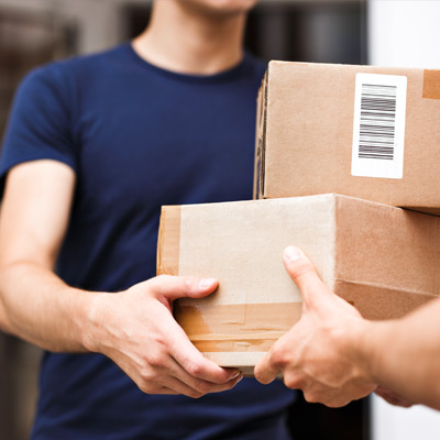 boxes being handed to a delivery person